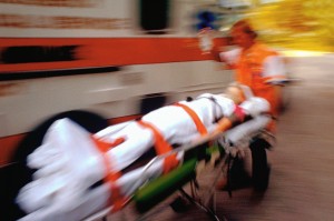 Paramedic Transporting Patient by Gurney